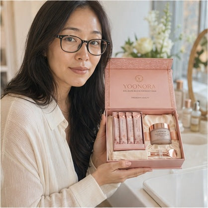 Creator with glasses holding YOONORA Glow Ritual Bundle